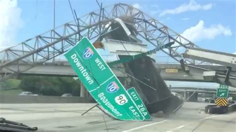 dump truck hits highway sign